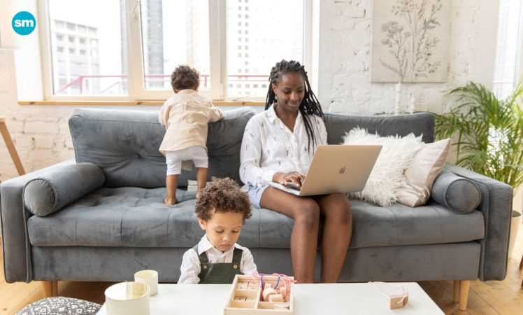 Working mom with children playing